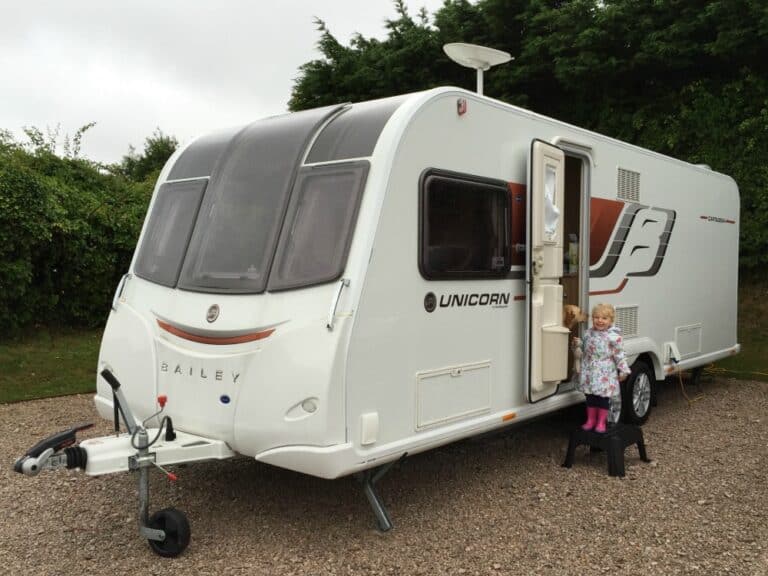 Tin Box Tot outside Bailey Unicorn Cartagena caravan