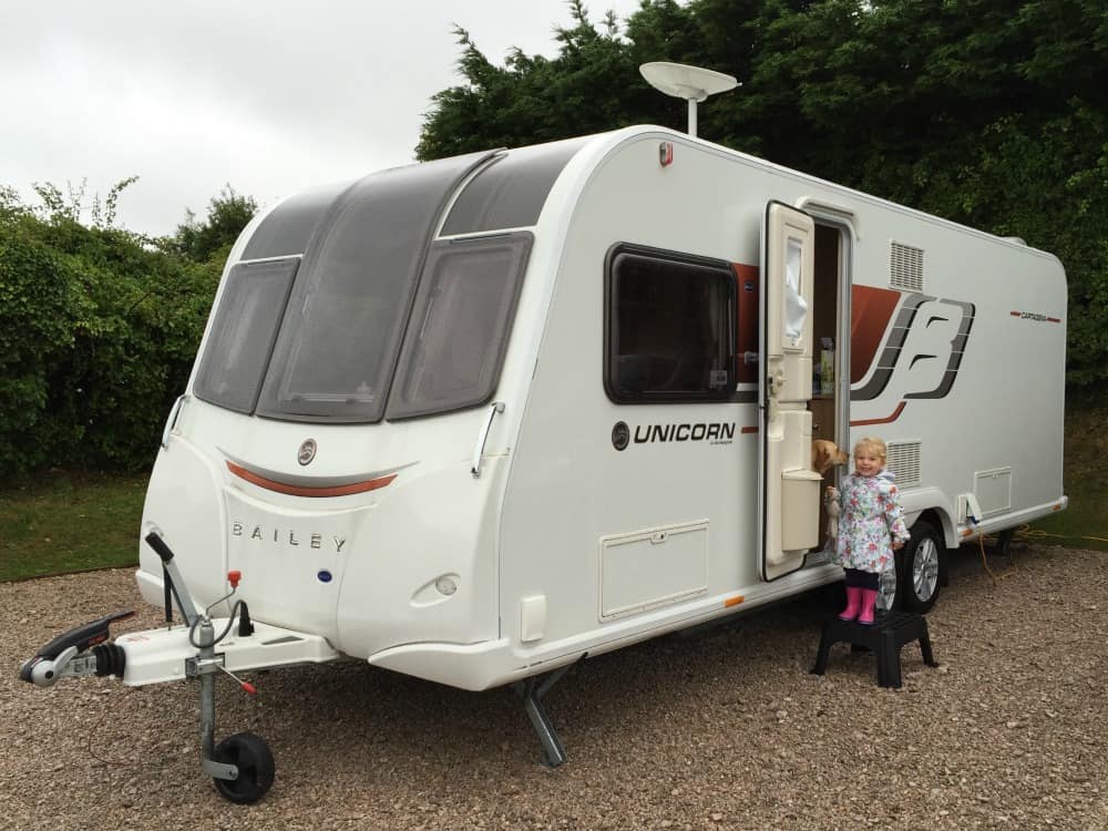 Tin Box Tot outside Bailey Unicorn Cartagena caravan