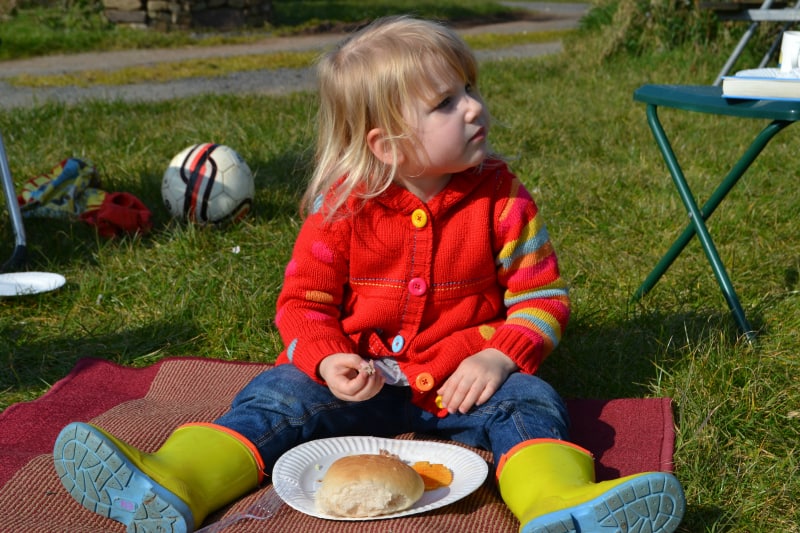 Tin Box Tot eating an alfresco lunch