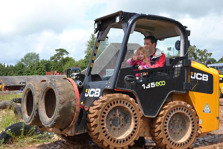 Riding on a digger at Diggerland - great Devon family days out