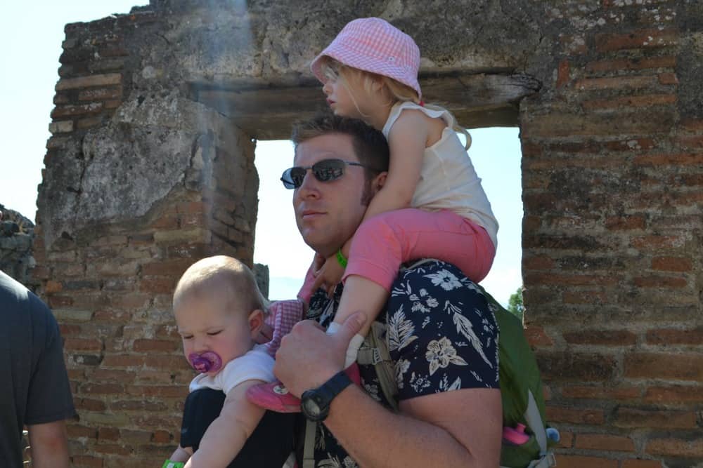 Mr Tin Box carrying Tin Box Baby and Tot at Pompeii - How not to see Pompeii with kids