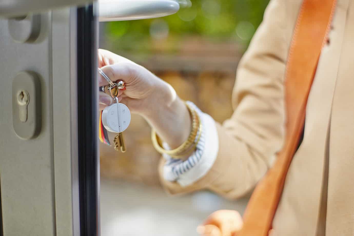 Myfox key fob on keyring being used at a front door