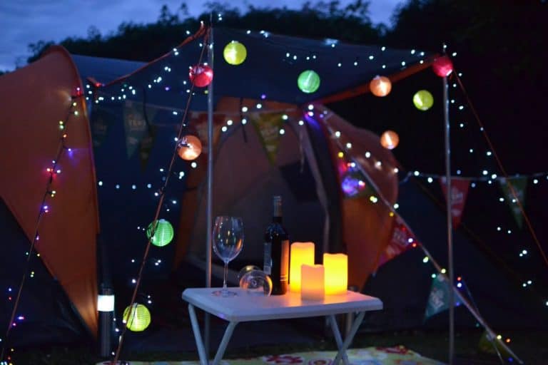 Tent decorated with fairy lights at night - Big Little Tent Festival