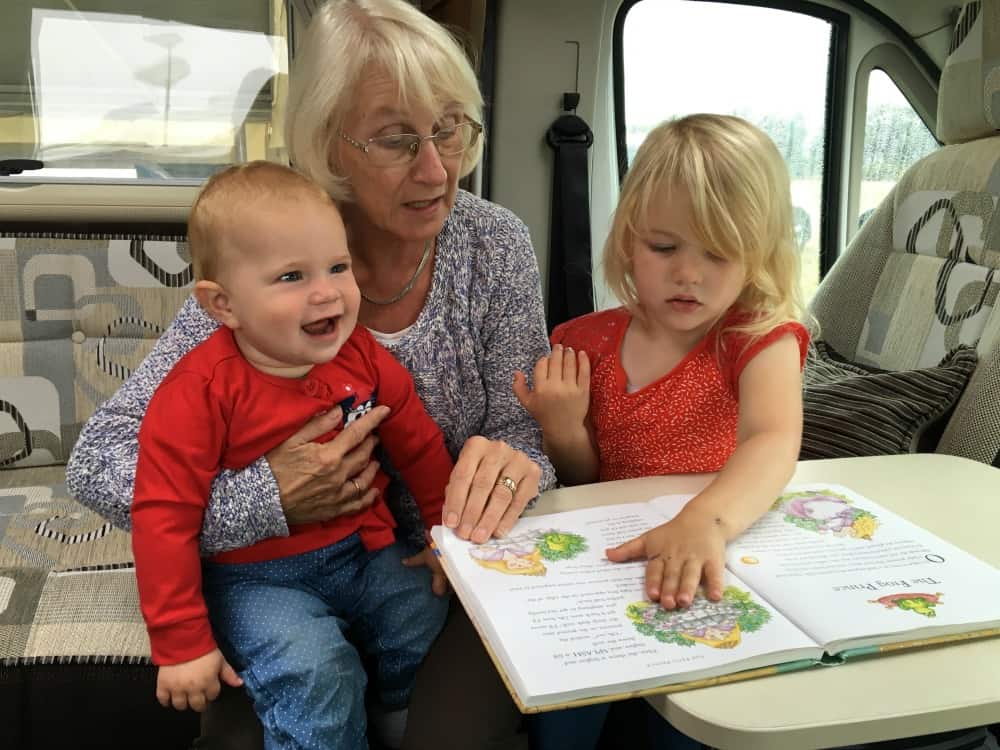 Tin Box girls and Grandma reading a book - Holidaying in South Devon, a caravan staycation