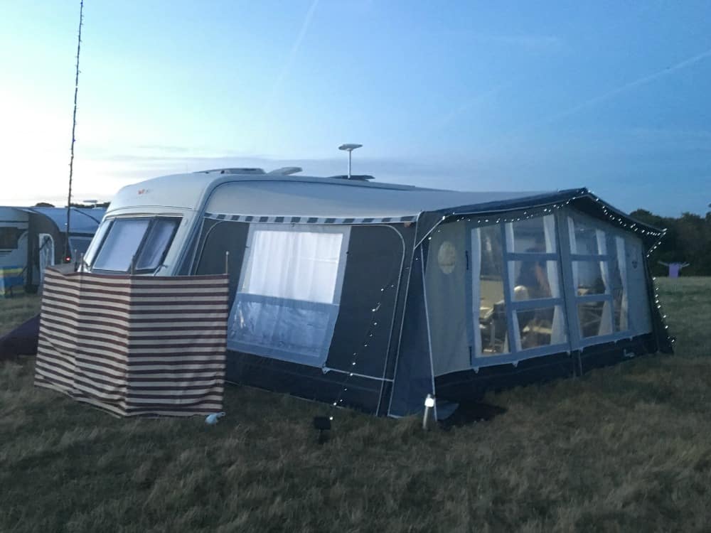 Caravan pitched in a field - caravan staycation