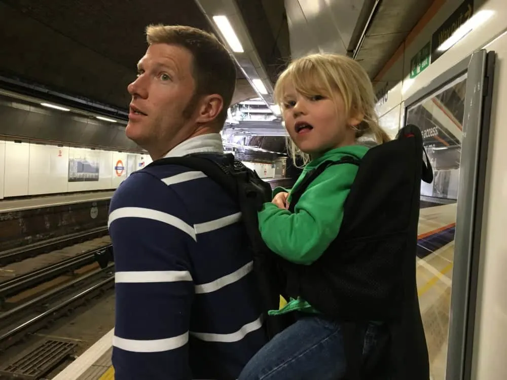 Mr Tin Box and Tot waiting for a tube train - Sanity saving tips for doing London with a toddler or baby