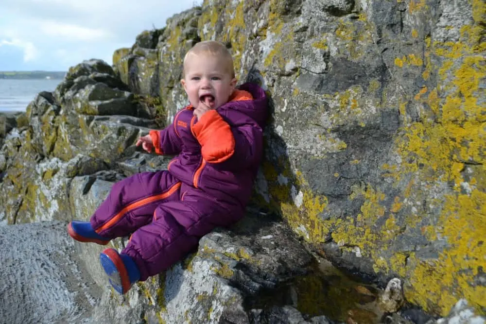 Tin Box Baby say on rocks - Cornwall with kids: outdoor family attractions