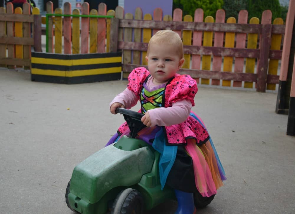 Tin Box Baby on ride on tractor at Woodlands Theme Park