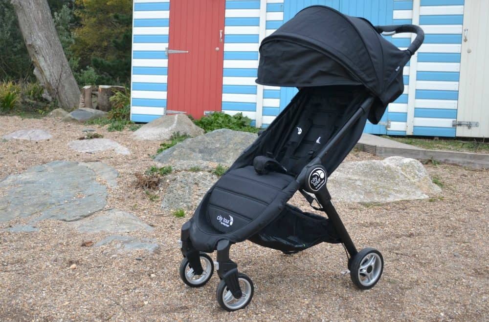 Stroller in front of beach huts - Baby Jogger City tour review - a great travel stroller