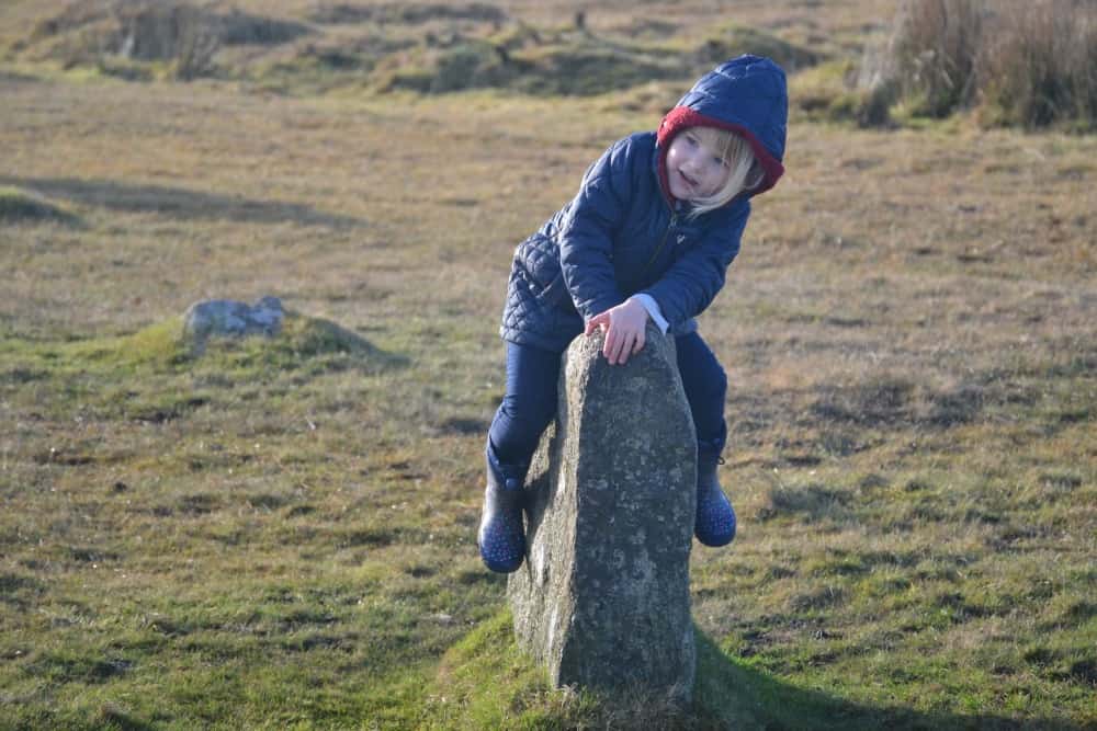 Tin Box Tot on stone - Stunning walks on Bodmin Moor for active families