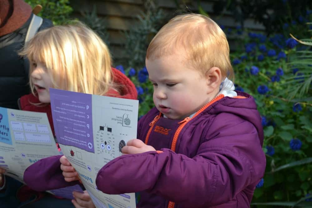 Baby looking at a map - butterflies at RHS Wisley