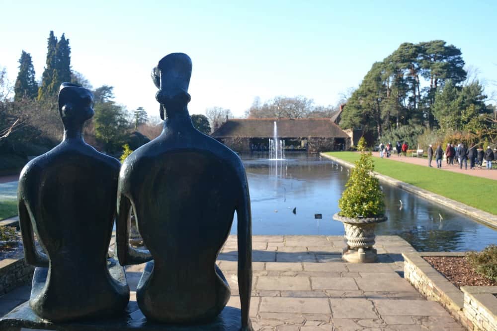 Sculptures overlooking pond - butterflies at RHS Wisley