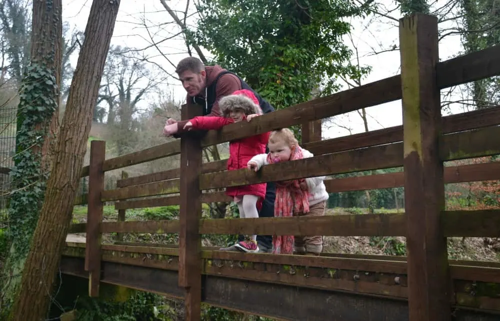 Playing Pooh Sticks on bridge at Bath Mill - Bath Mill Lodge Retreat review