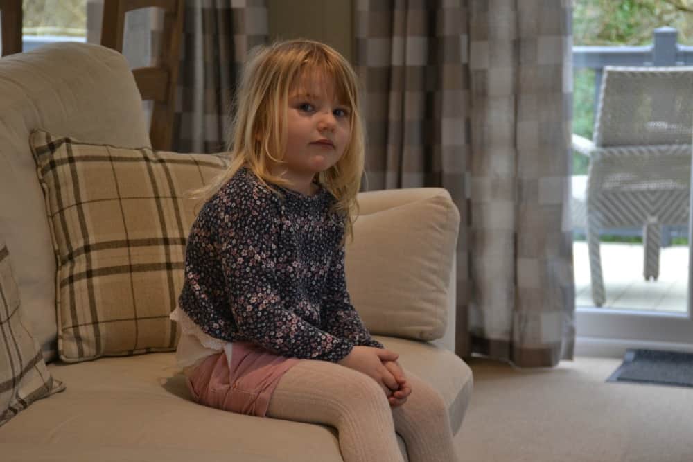 Tin Box Toy on settee in lodge - Bath Mill Lodge Retreat review