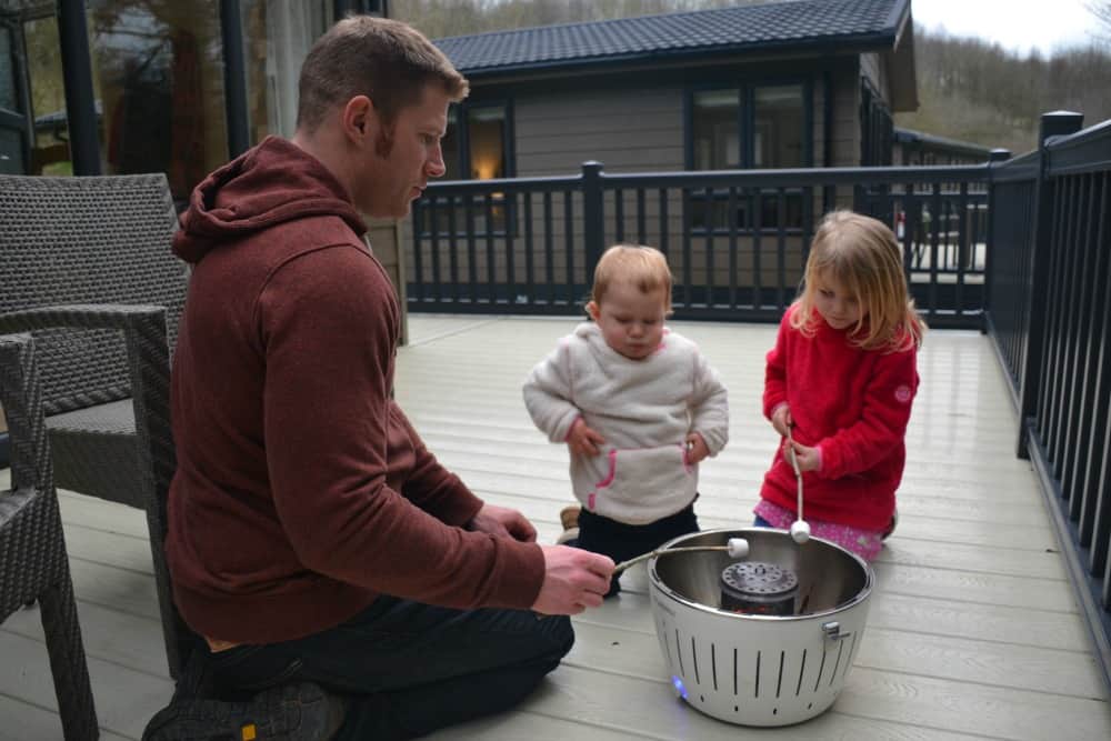 Toasting marshmallows on decking - Bath Mill Lodge Retreat review
