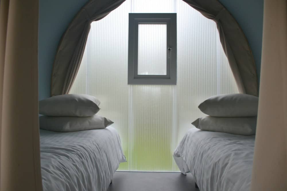 Twin room from kitchen glamping pod at Oakdown Holiday Park