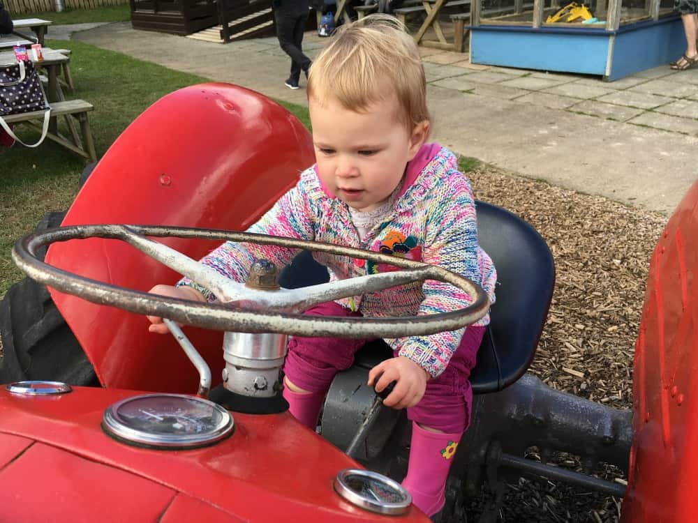 Tin Box Baby on tractor - Devon day out at Pennywell Farm