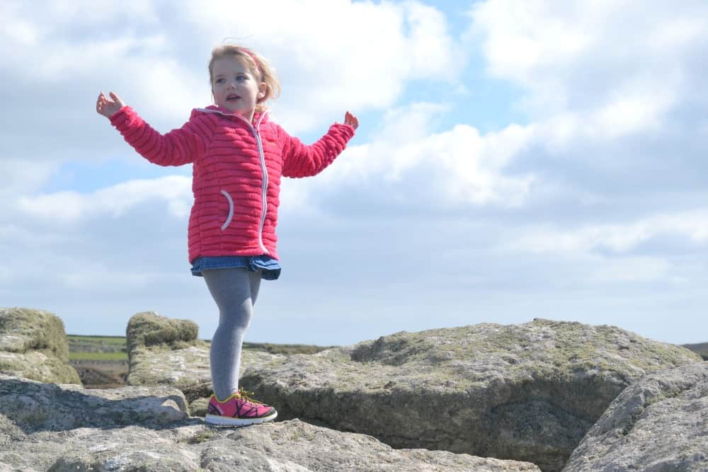 Tin Box Tot on rock at Land's End: Land's End with kids