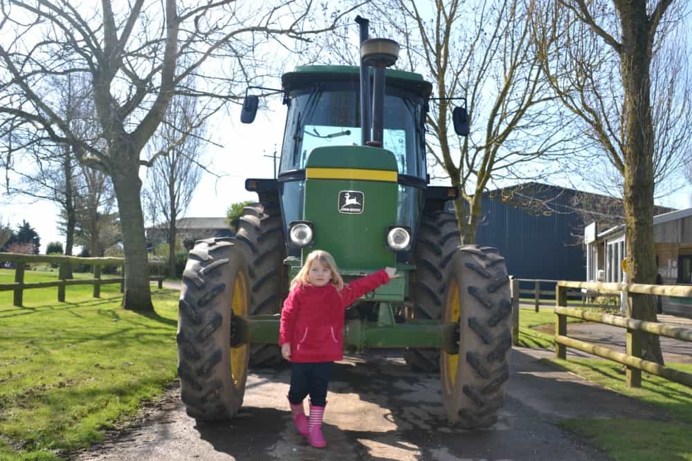 Tin Box Tot and tractor at Tin Box Tot sat in model train at World of Country Life