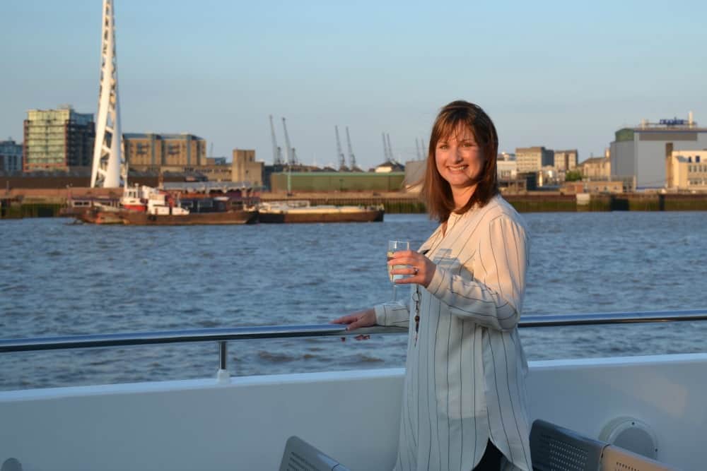 Tin Box Traveller on upper deck of City Cruises - Perfect weekend wardrobe for London with M and M Direct