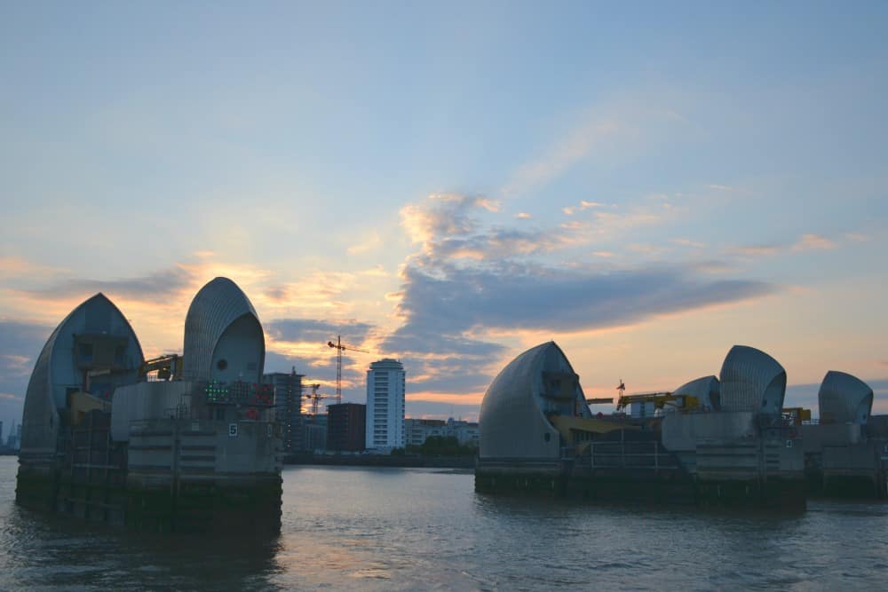 Thames Barrier at sun set - Perfect weekend wardrobe for London with M and M Direct