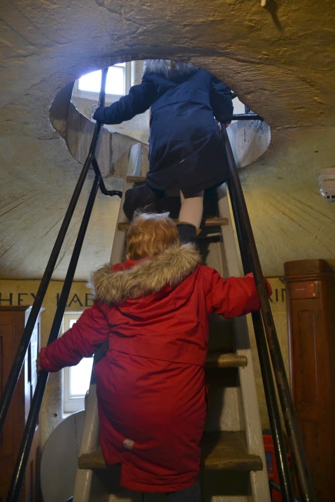 Tin Box girls climbing Seaton's Tower - toddler days out in Devon