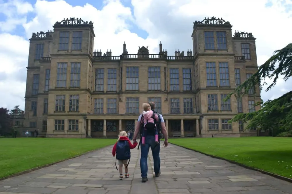 Tin Box family walking towards entrance of Hardwick Hall National Trust Derbyshire