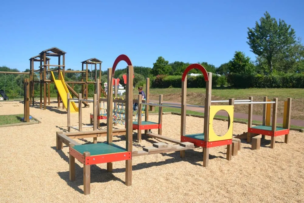 Children's playground at Pin Parasol - Heated outdoor pool at Yelloh! Village Pin Parasol - caravan holiday in France, Al Fresco Holidays