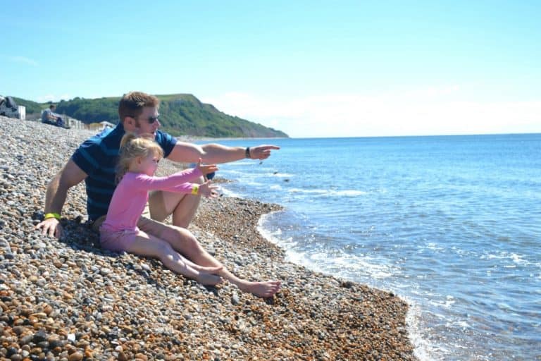 Mr TIn Box and Tot at Seaton beach near Andrewshayes - an East Devon holiday park review