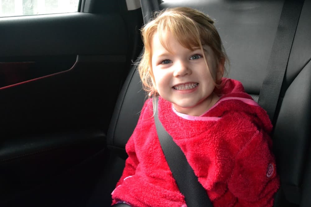 Toddler in mifold travel car seat - Toddler running - 5 tips for civilised road trips with toddlers