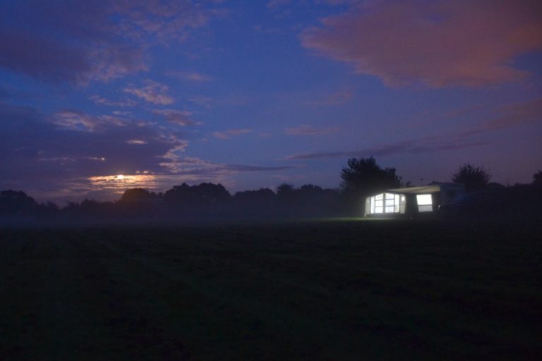 Caravan in a field at night - family travel - Tin Box Traveller Diaries August 2017