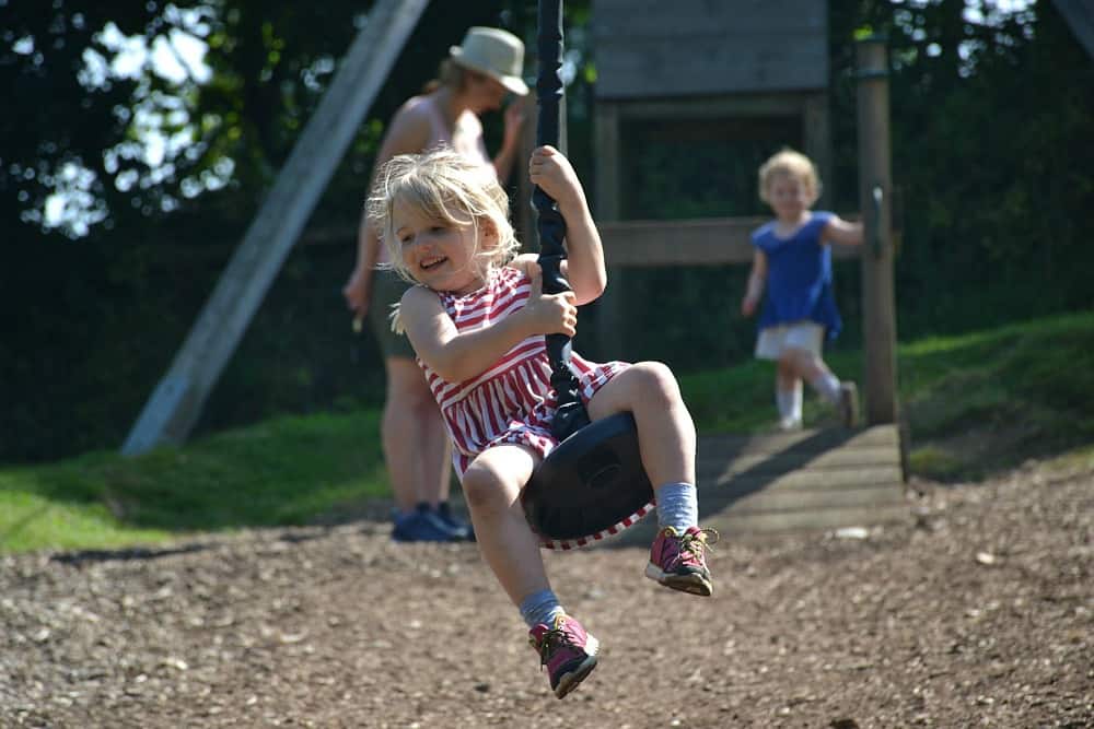 Tin Box Tot on zip wire at Canonteign Falls - England's highest manmade waterfall