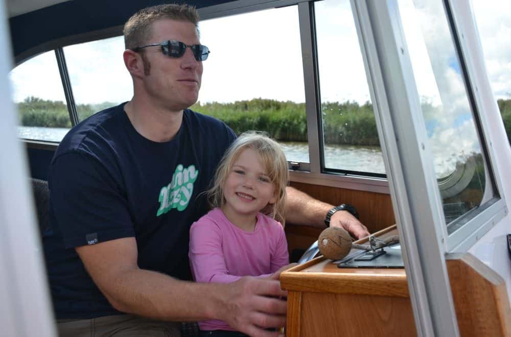 Tin Box Tot driving boat - Norfolk Broads with kids