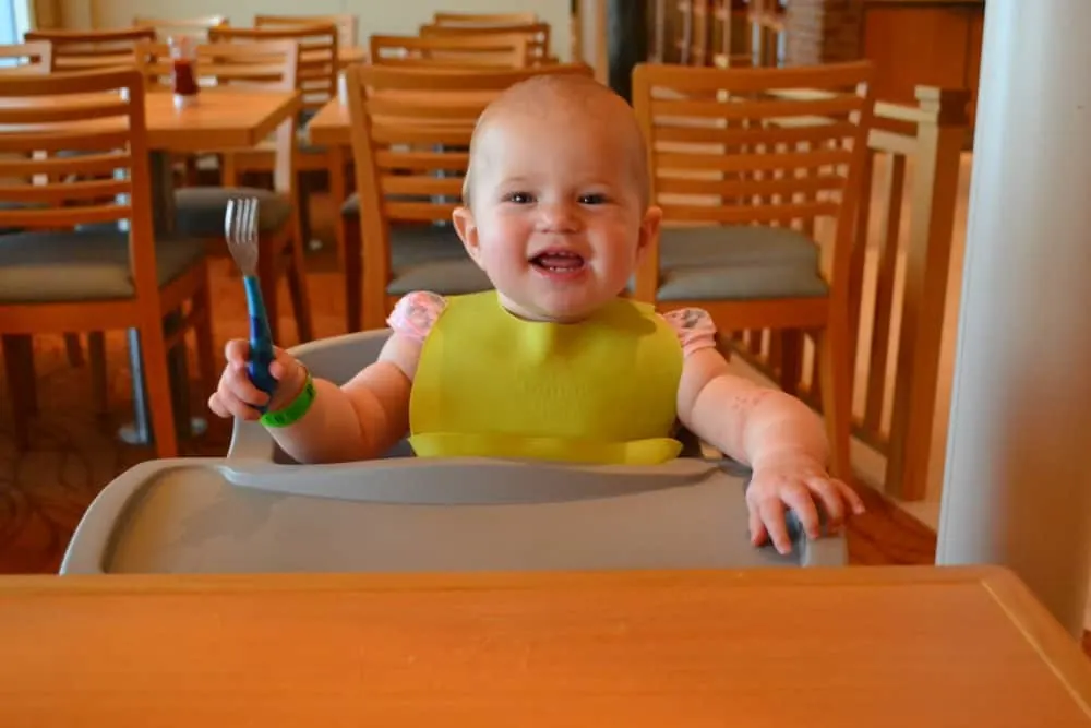 Baby eating in dining room - cruising with a baby