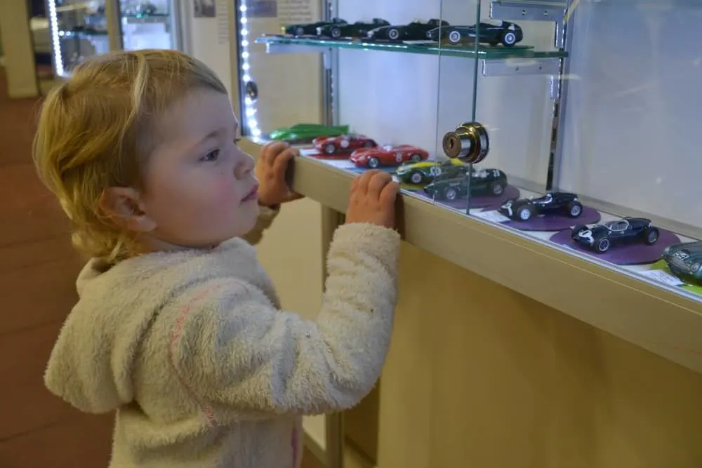 Baby looking at toy cars at Haynes International Motor Museum
