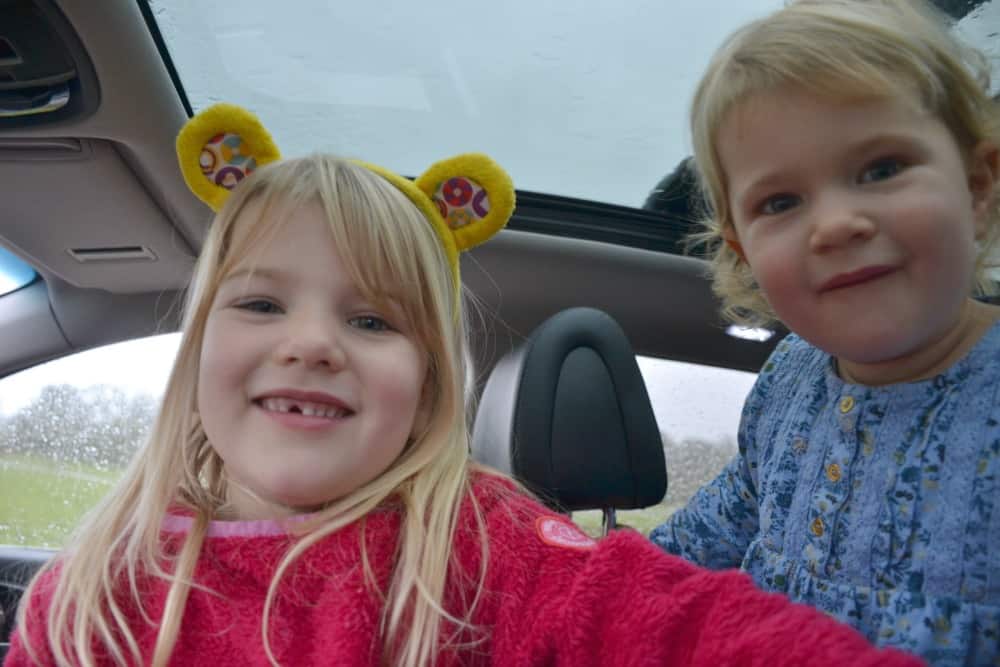 Tin Box girls in car during drive through safari at Longleat Safari Park
