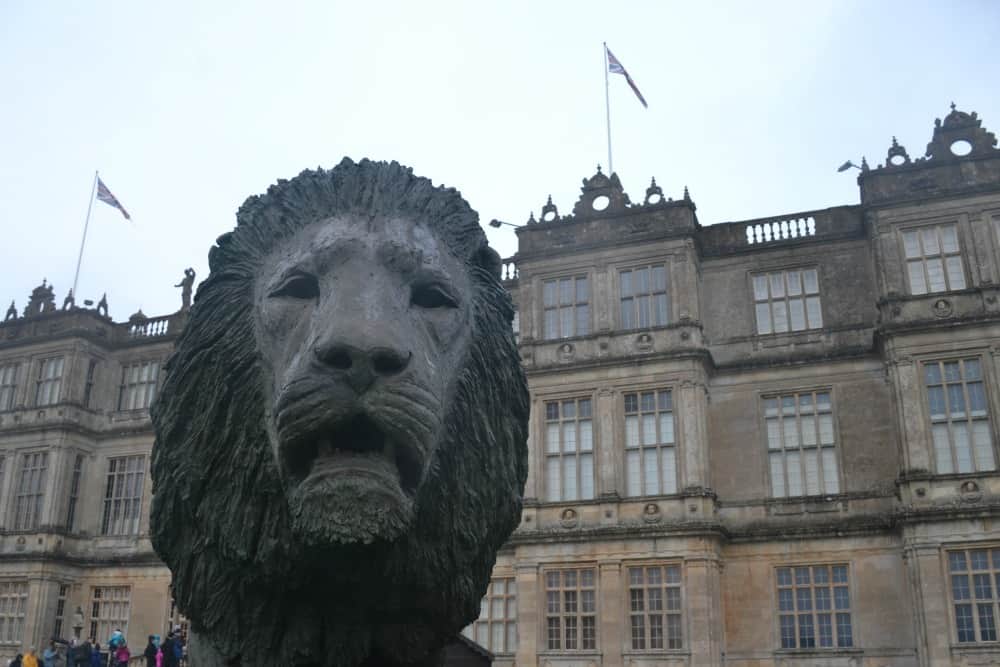 Lion statue and Longleat House - Longleat in the rain