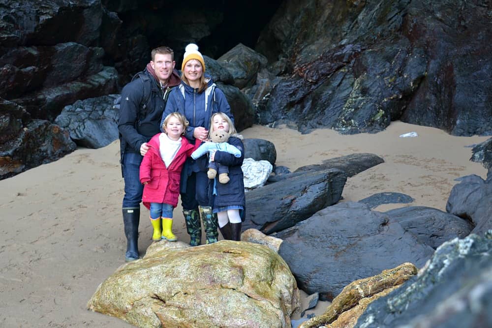 Tin box family in the cave at the bottom of Bedruthan Steps in North Cornwall