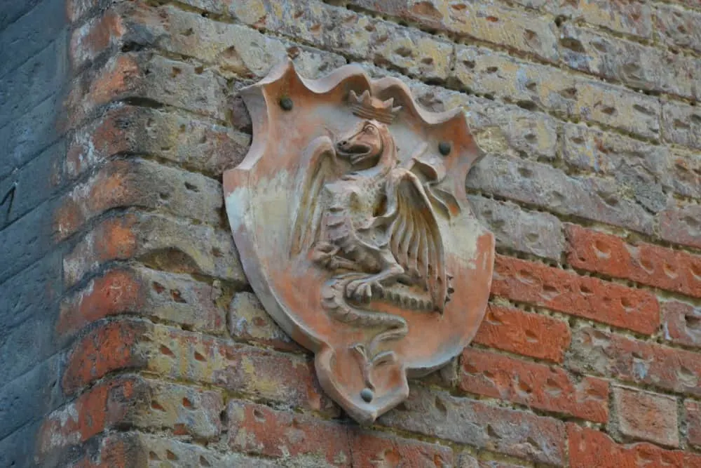 Dragon neighbourhood sign, Siena Italy with kids