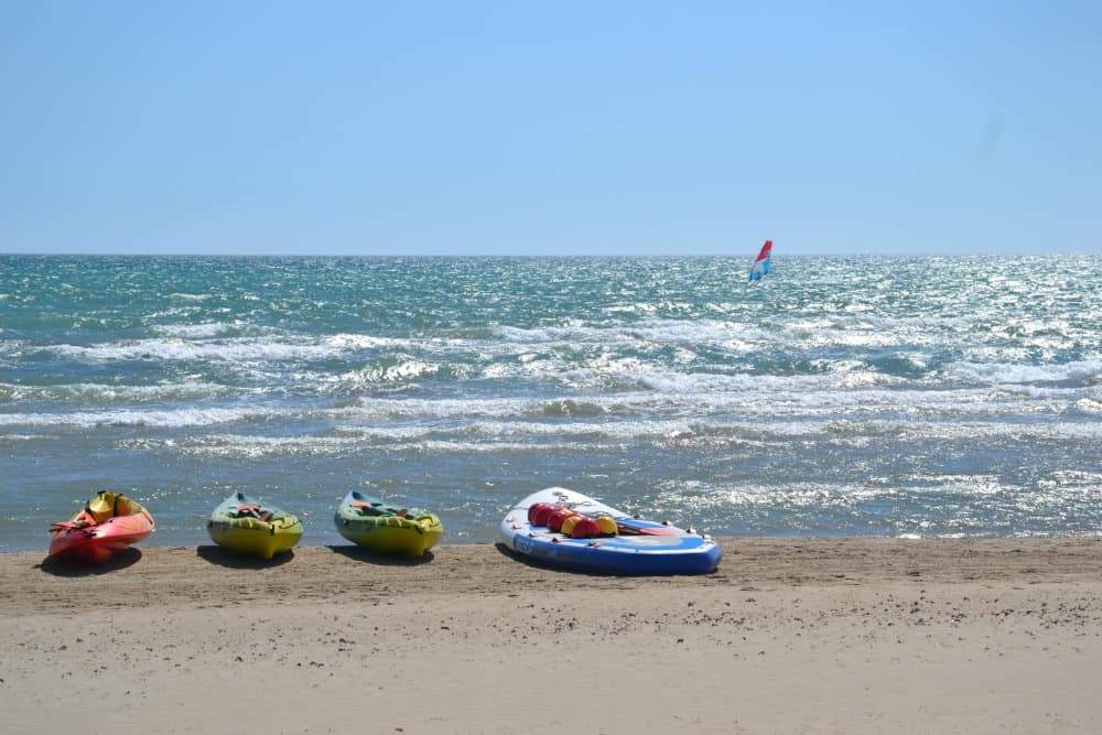 Kayak and SUP board at Vilianova beach - Costa Barcelona with kids