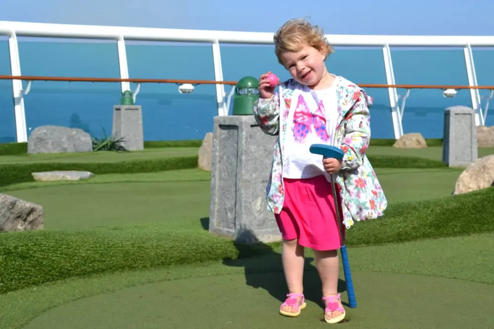Tin Box Baby playing mini golf on Navigator of the Seas - Navigator of the Seas with kids