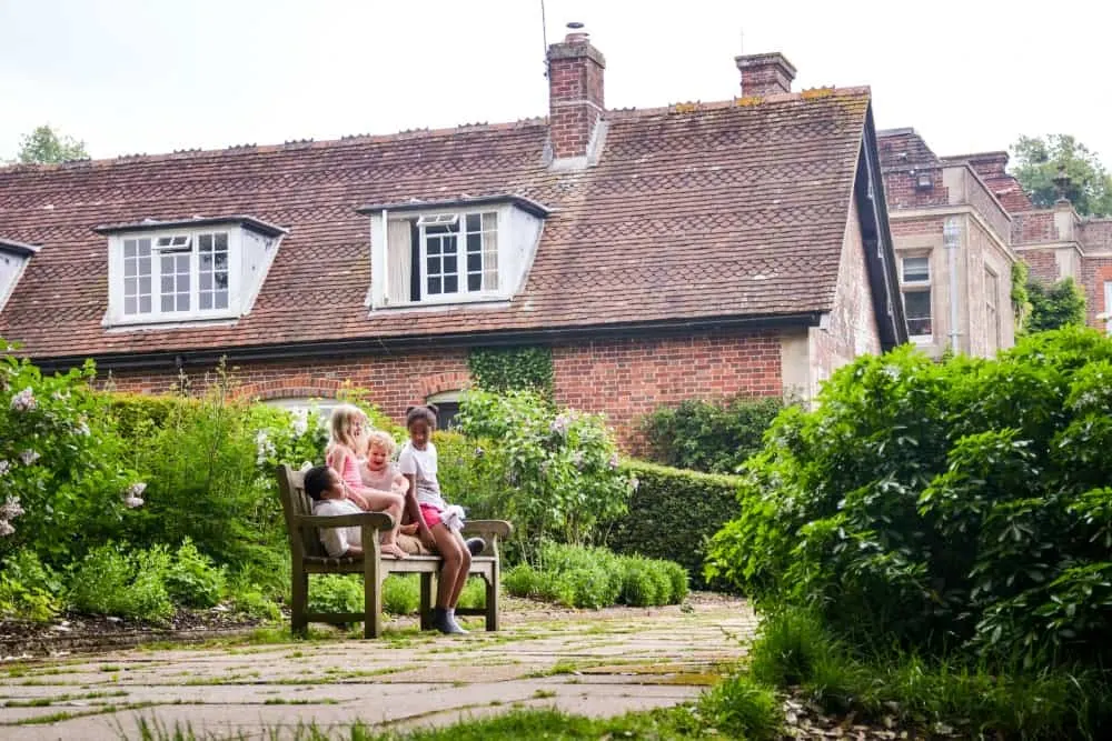Tin Box kids in front of manor house - Hinton Ampner
