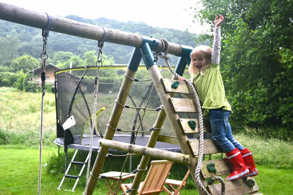Tot on climbing frame - Kidunk summer play suit - kids clothing for outdoor play