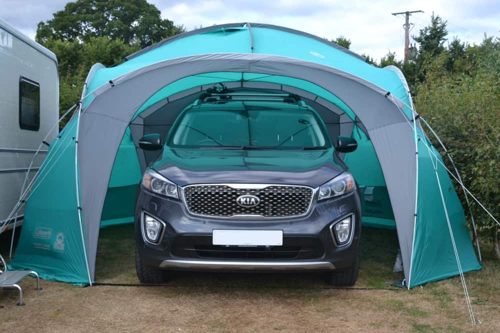 Car in Coleman Event Dome XL shelter outside caravan - the best gazebo for camping?