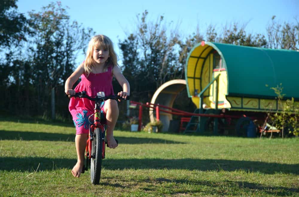 Tot on bike at Welcombe X - North Devon camp site review
