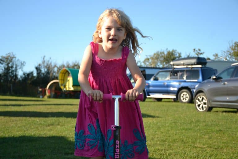 Tot on scooter at Welcombe X - North Devon camp site review