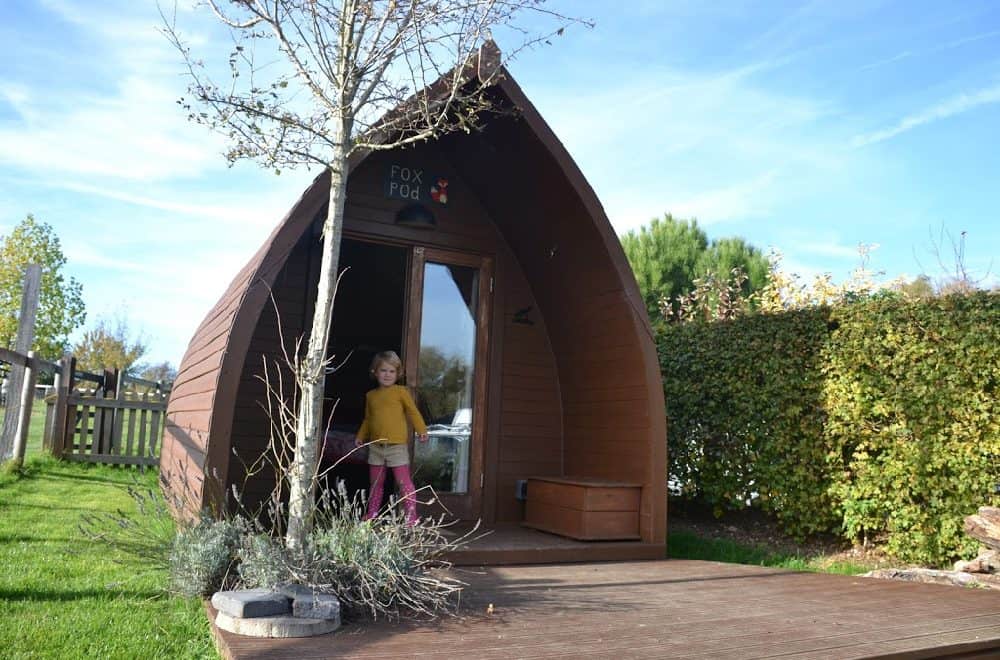 Baby outside Fox Pod - Stonehenge Campsite review
