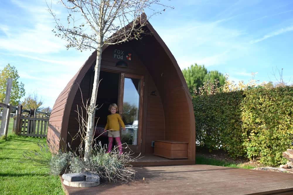 Baby outside Fox Pod - Stonehenge Campsite review
