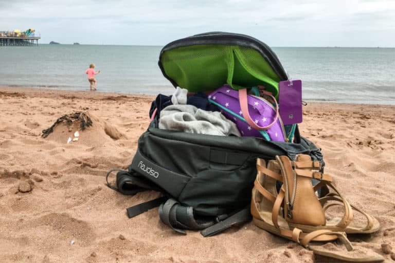 Rucksack on beach - Best rucksack for travelling: Osprey Farpoint 40 backpack review