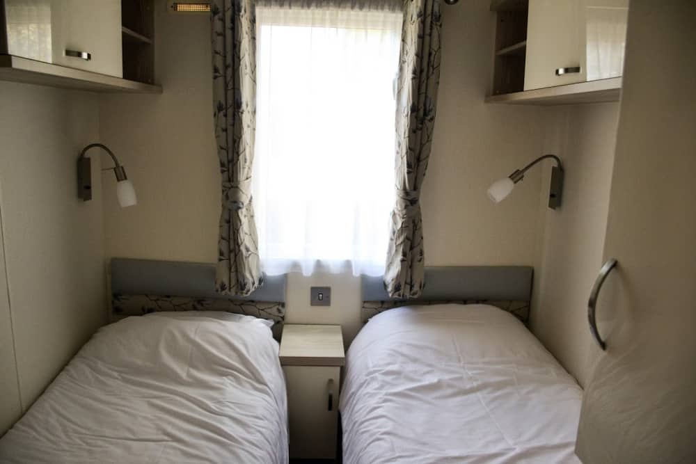 Small twin room - luxury caravan with hot tub at Andrewshayes Holiday Park Devon